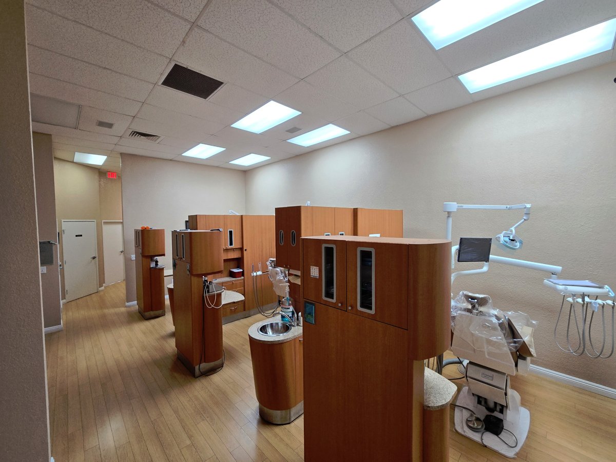 Arroyo Dental treatment area with warm wood cabinetry